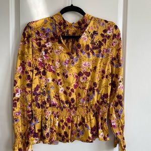 Scoop mock neck top with peplum waist